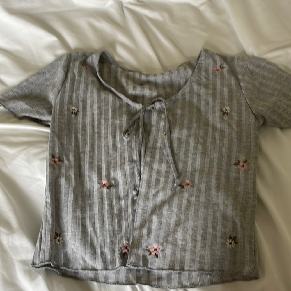 Open flower tie over shirt